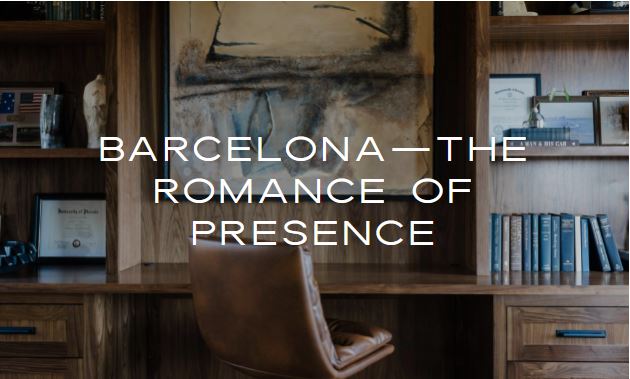 Modern wood shelving unit with a chair in front, adorned with books and framed pictures, featuring a large abstract painting above.